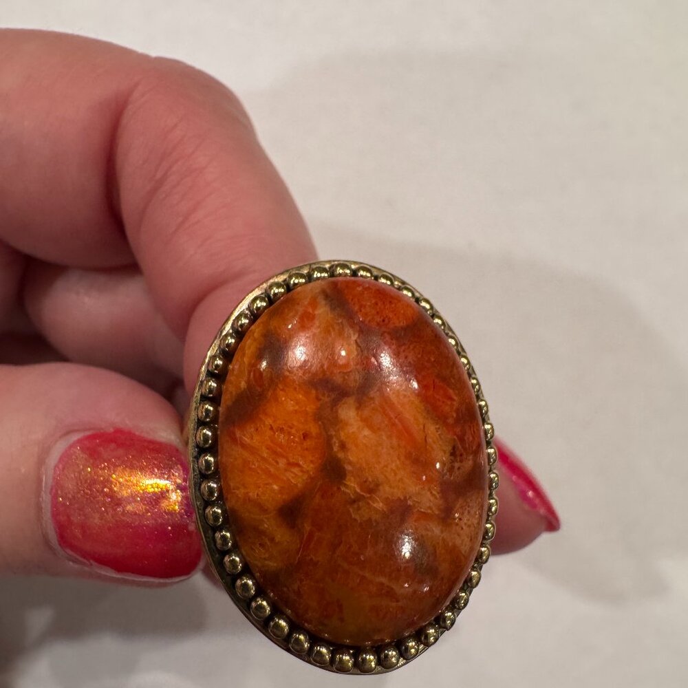 Striking oval gold-tone orange ring